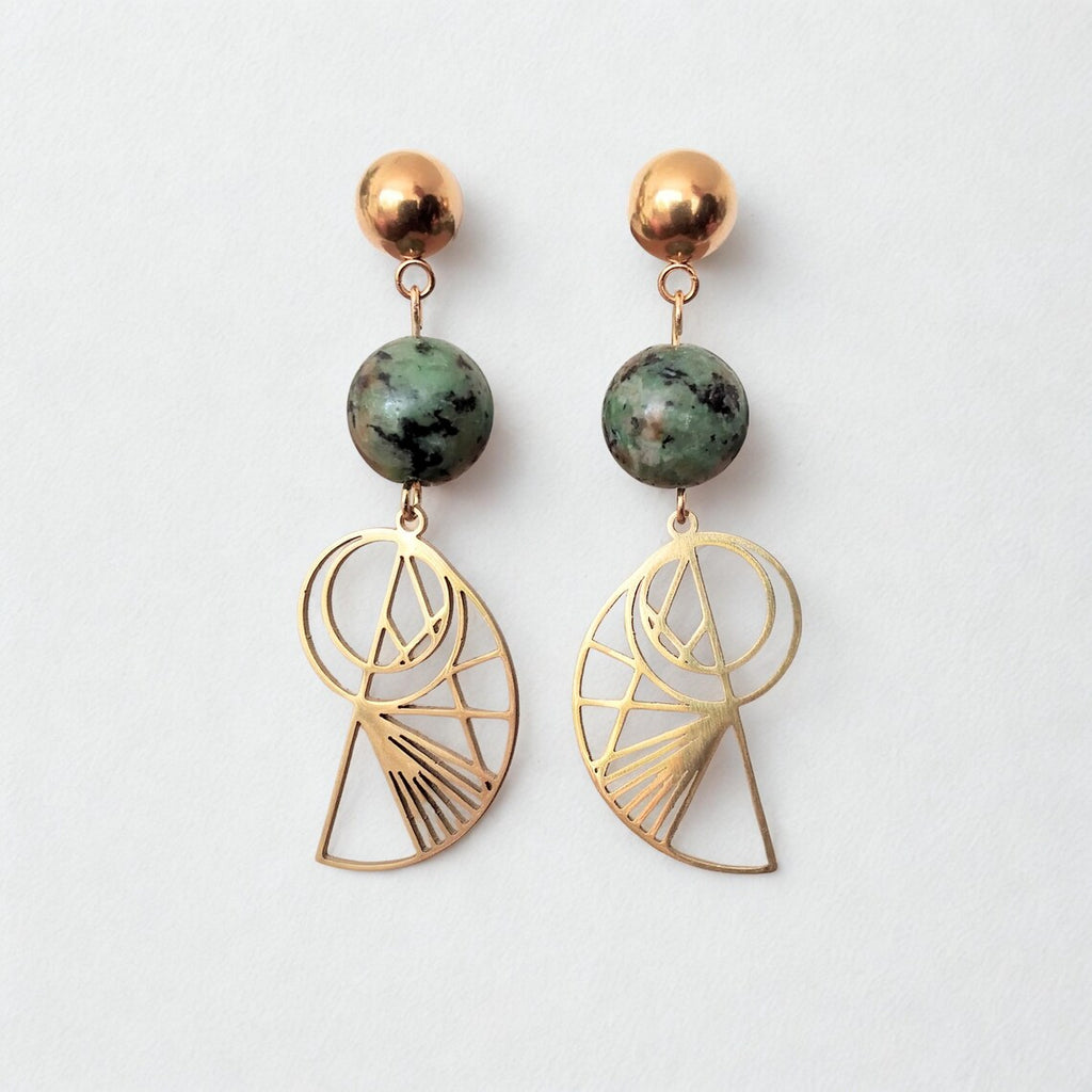 Bohemian gold-plated stainless steel drop earrings featuring round, green-speckled African Turquoise beads and geometric Golden Ratio shell charms on a white display